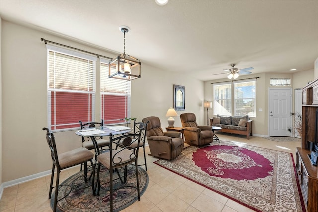 tiled dining area featuring ceiling fan