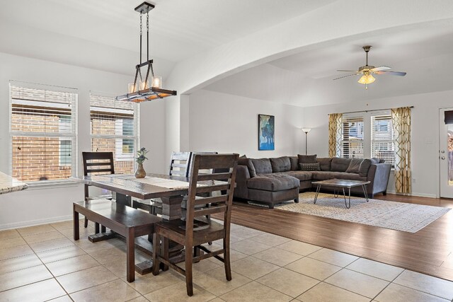 tiled dining room featuring ceiling fan and a wealth of natural light