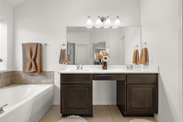 bathroom featuring a bath, tile patterned flooring, and vanity