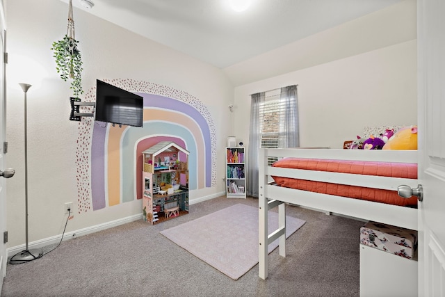 carpeted bedroom featuring lofted ceiling