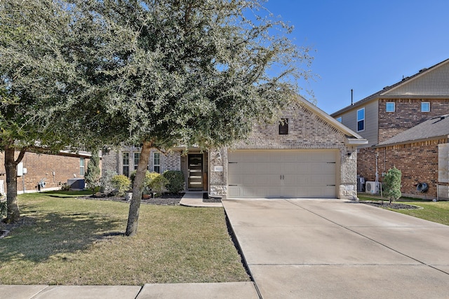 view of front facade with a front yard, a garage, and ac unit