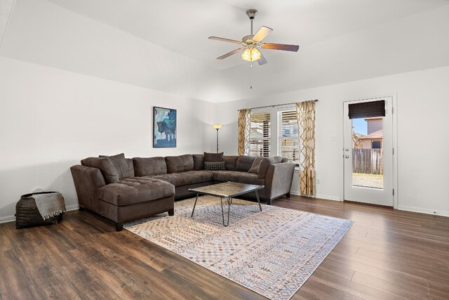 living room with ceiling fan and dark hardwood / wood-style floors