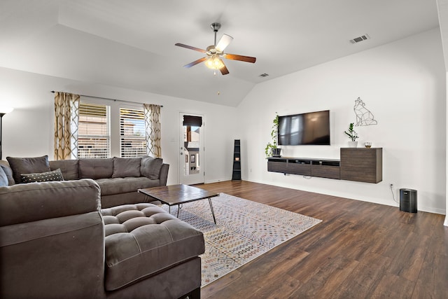 living room with ceiling fan, vaulted ceiling, and dark hardwood / wood-style floors