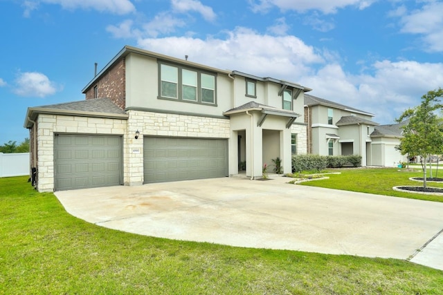 view of front of house featuring driveway, a shingled roof, stone siding, a front yard, and stucco siding