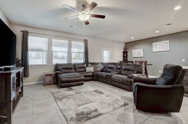 living room with visible vents, plenty of natural light, and light tile patterned floors