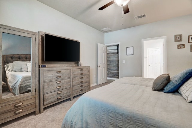 bedroom with a ceiling fan, light colored carpet, and visible vents