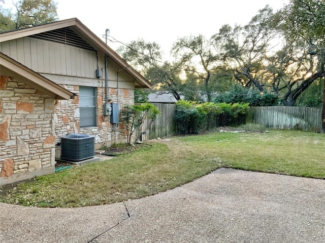 view of yard featuring a patio and central AC