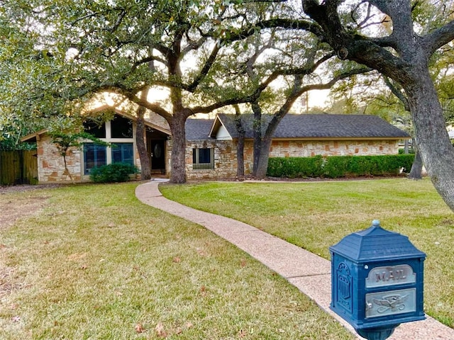 view of front of home featuring a front lawn