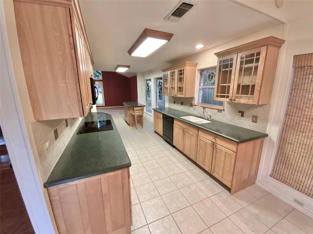 kitchen featuring backsplash, light brown cabinetry, sink, and black appliances