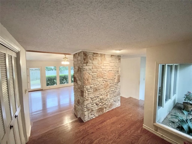 interior space featuring hardwood / wood-style floors and a textured ceiling