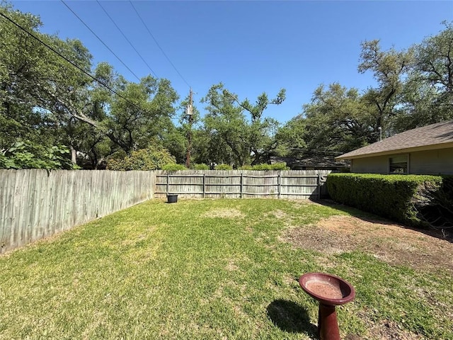 view of yard featuring a fenced backyard