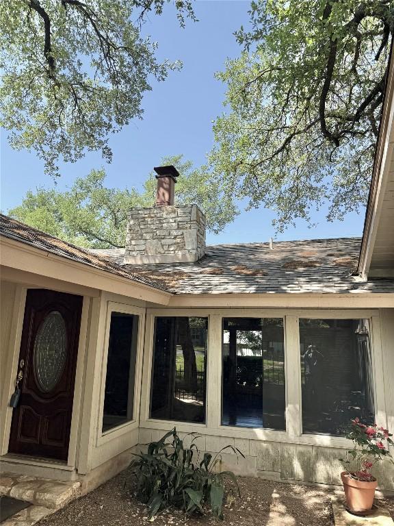 back of property featuring a chimney