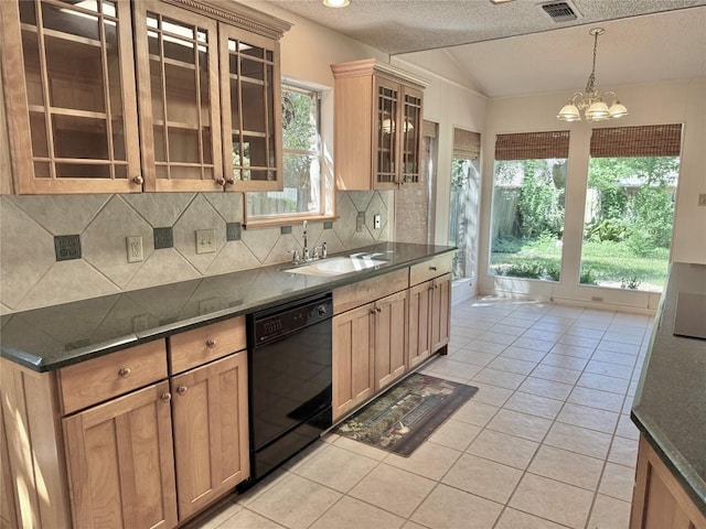 kitchen with a textured ceiling, a sink, a chandelier, backsplash, and black dishwasher