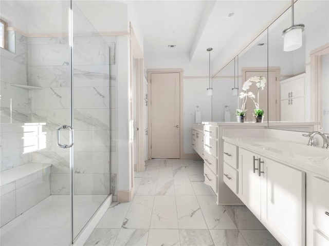 bathroom featuring vanity and a shower with shower door