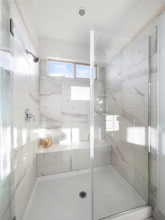 bathroom featuring walk in shower