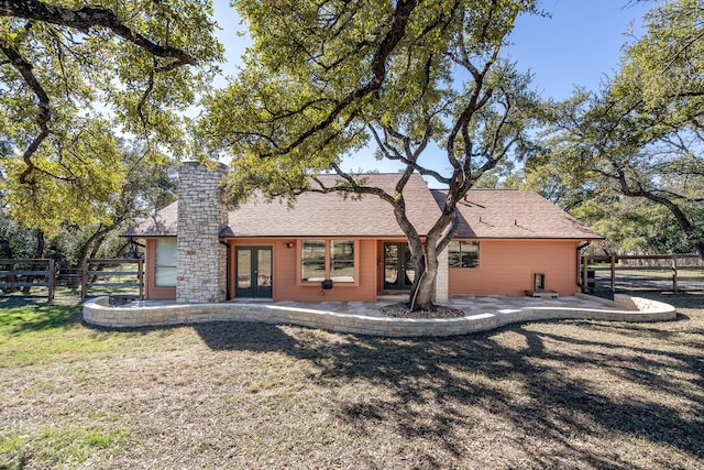 back of house featuring french doors