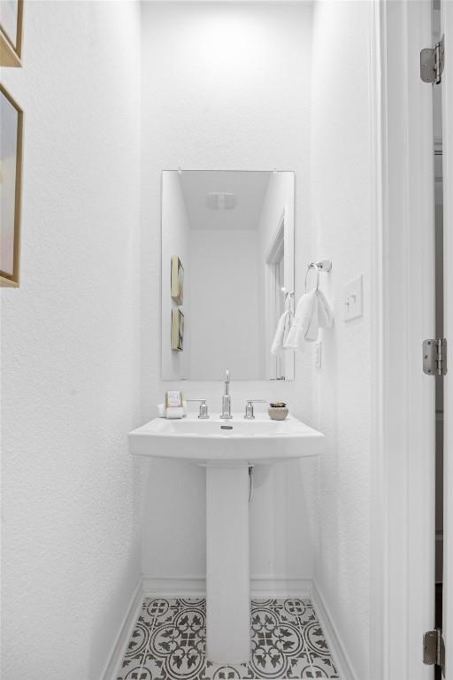 bathroom featuring tile patterned flooring