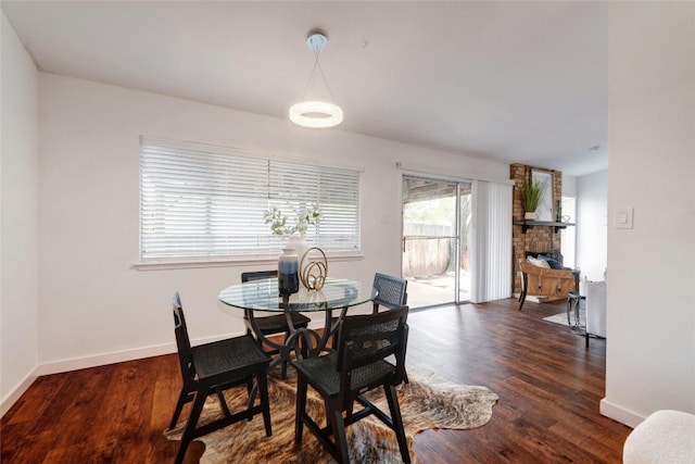 dining room with dark wood-type flooring