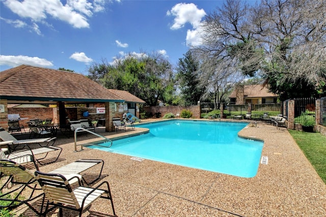 view of swimming pool featuring a gazebo and a patio