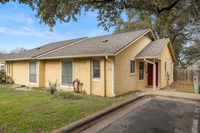 ranch-style house with a patio and a front yard