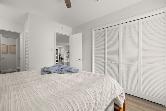 bedroom with ceiling fan and wood-type flooring