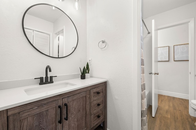 bathroom featuring vanity and hardwood / wood-style flooring