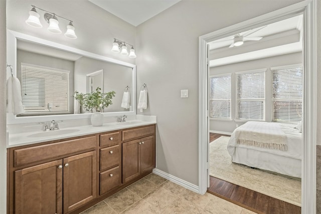 bathroom featuring tile patterned flooring, vanity, and ceiling fan