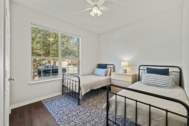 bedroom with ceiling fan and hardwood / wood-style flooring