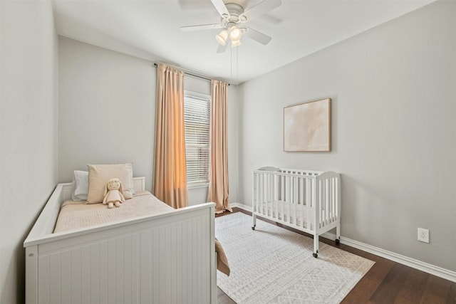 bedroom featuring ceiling fan and dark hardwood / wood-style floors