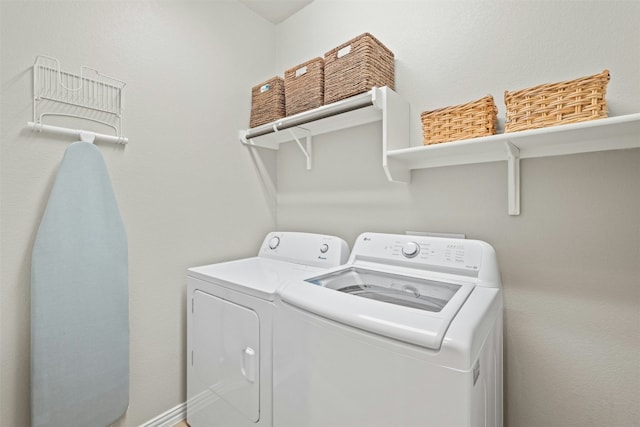 washroom with washer and dryer