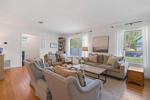 living room with light hardwood / wood-style flooring