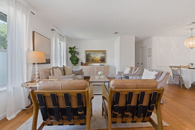 living room with light hardwood / wood-style flooring