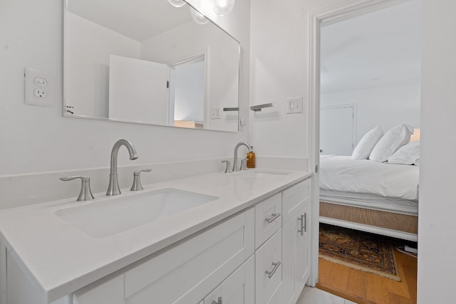 bathroom featuring vanity and wood-type flooring