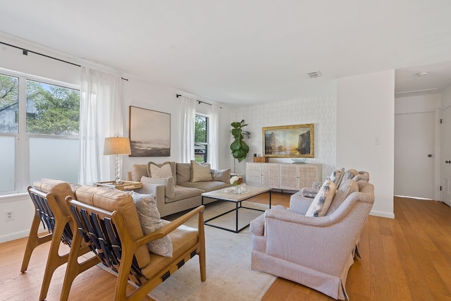 living room with light hardwood / wood-style floors