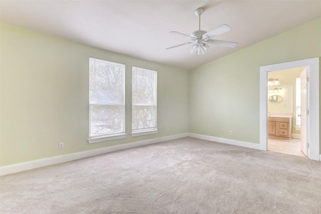 empty room with light colored carpet and ceiling fan