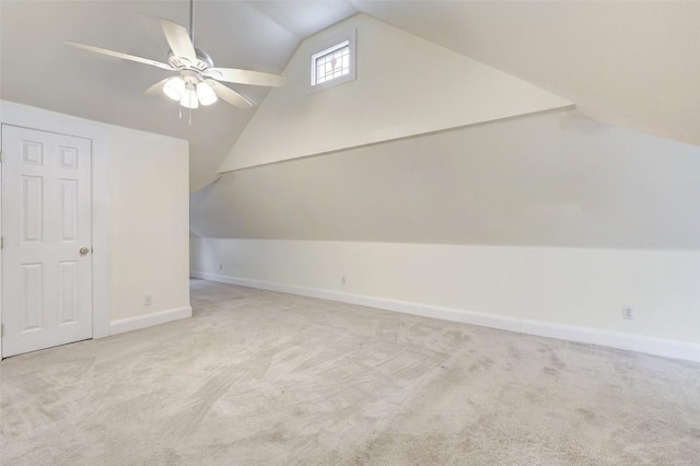 additional living space featuring ceiling fan, light carpet, and lofted ceiling