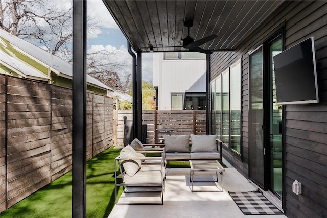 view of patio / terrace featuring an outdoor living space and ceiling fan