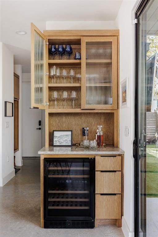 bar featuring decorative backsplash and wine cooler