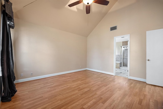 spare room with ceiling fan, light wood-type flooring, and high vaulted ceiling