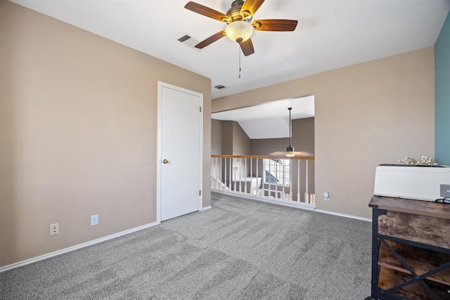 interior space featuring ceiling fan and vaulted ceiling