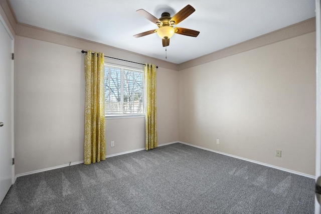 unfurnished room with carpet floors, baseboards, and ceiling fan