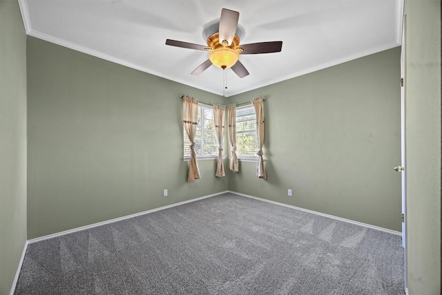 empty room with ceiling fan, ornamental molding, and carpet floors