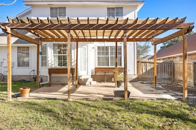 back of property with a lawn, a pergola, a fenced backyard, and entry steps