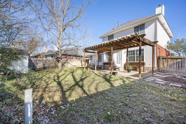 rear view of house with a pergola, a fenced backyard, a chimney, a lawn, and a patio