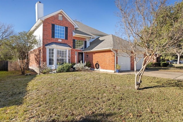 view of front property featuring a front yard and a garage