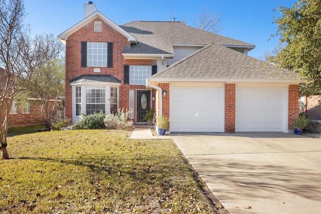 front facade with a front yard and a garage