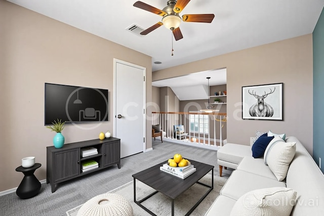 living area with visible vents, ceiling fan, and light carpet