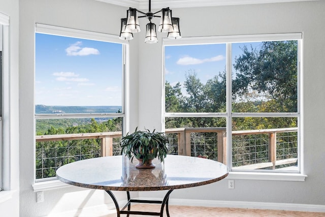 sunroom with a notable chandelier