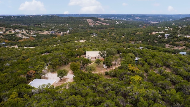 drone / aerial view featuring a view of trees