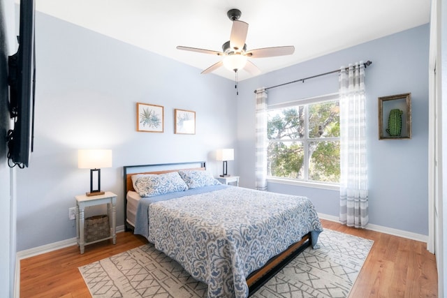 bedroom with light wood-type flooring and ceiling fan